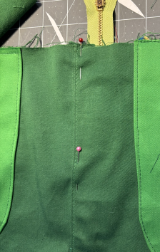 Pin left zipper flap